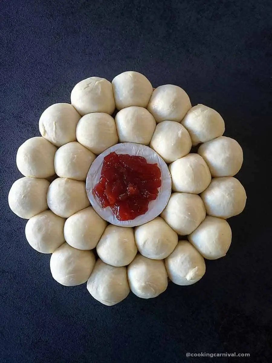 arranging pull apart rolls on a baking tray