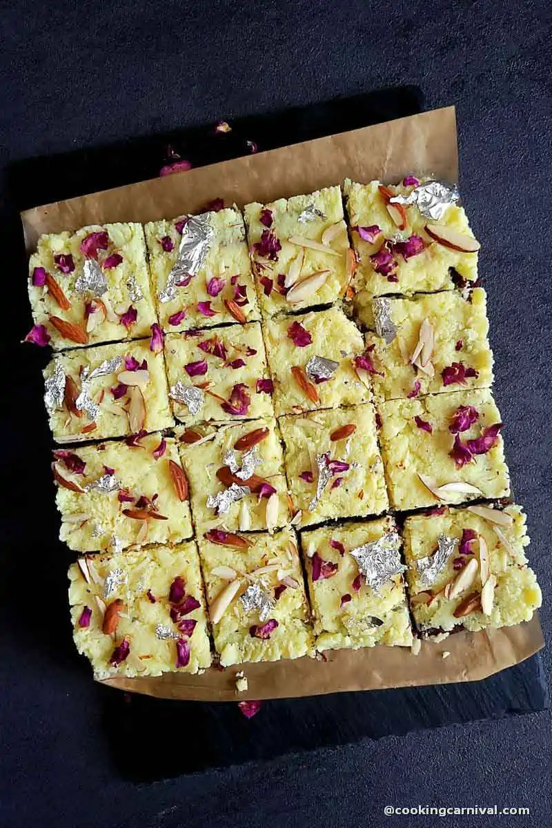 Burfi brownie cut into square pieces.