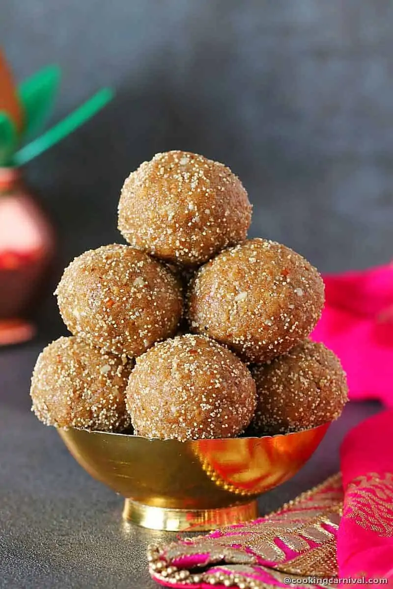 Stack of churma ladoo in a traditional bowl