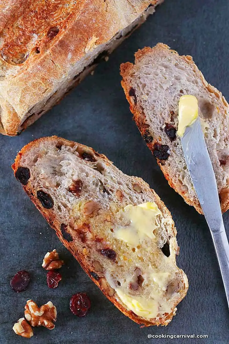 butter slathered Cranberry walnut no knead breadbread