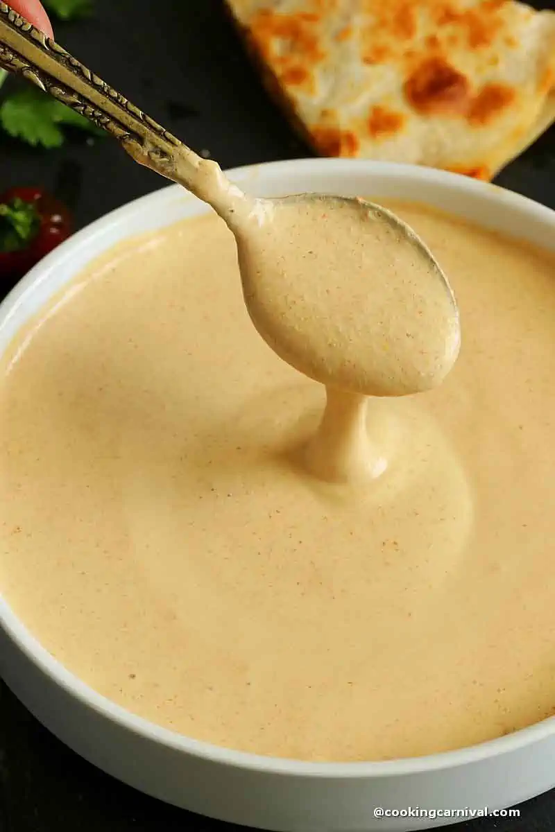 showing texture of the Creamy Jalapeno Sauce with spoon