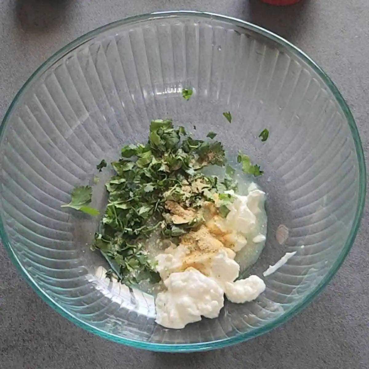 mayo, sour cream, elote seasoning, cilantro and lime juice in a bowl.