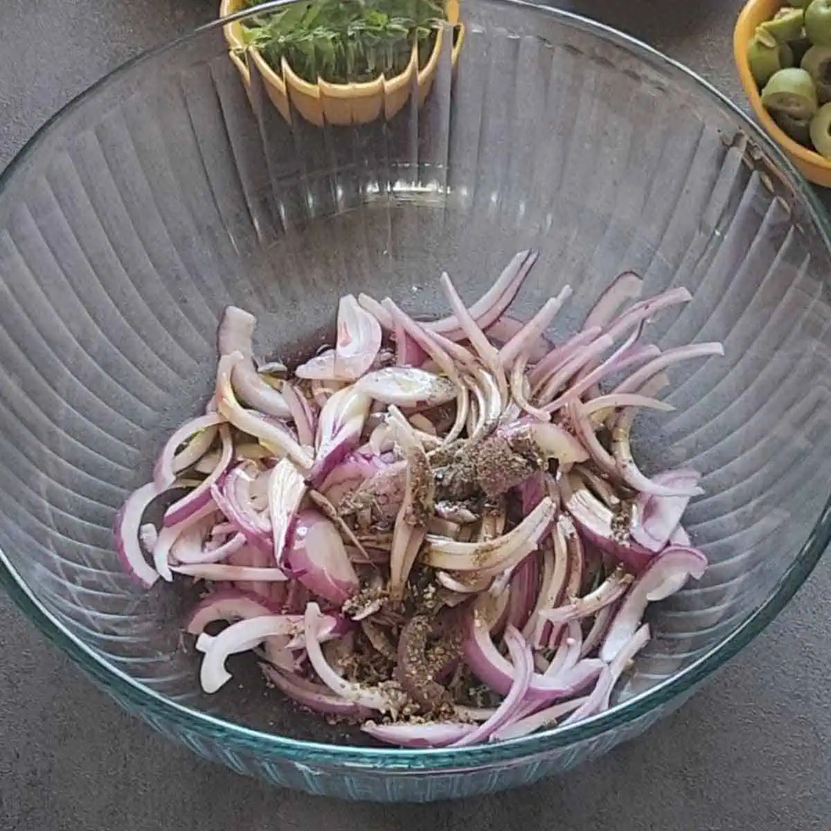 Onion, red wine vinegar, olive oil, oregano and salt in a bowl.