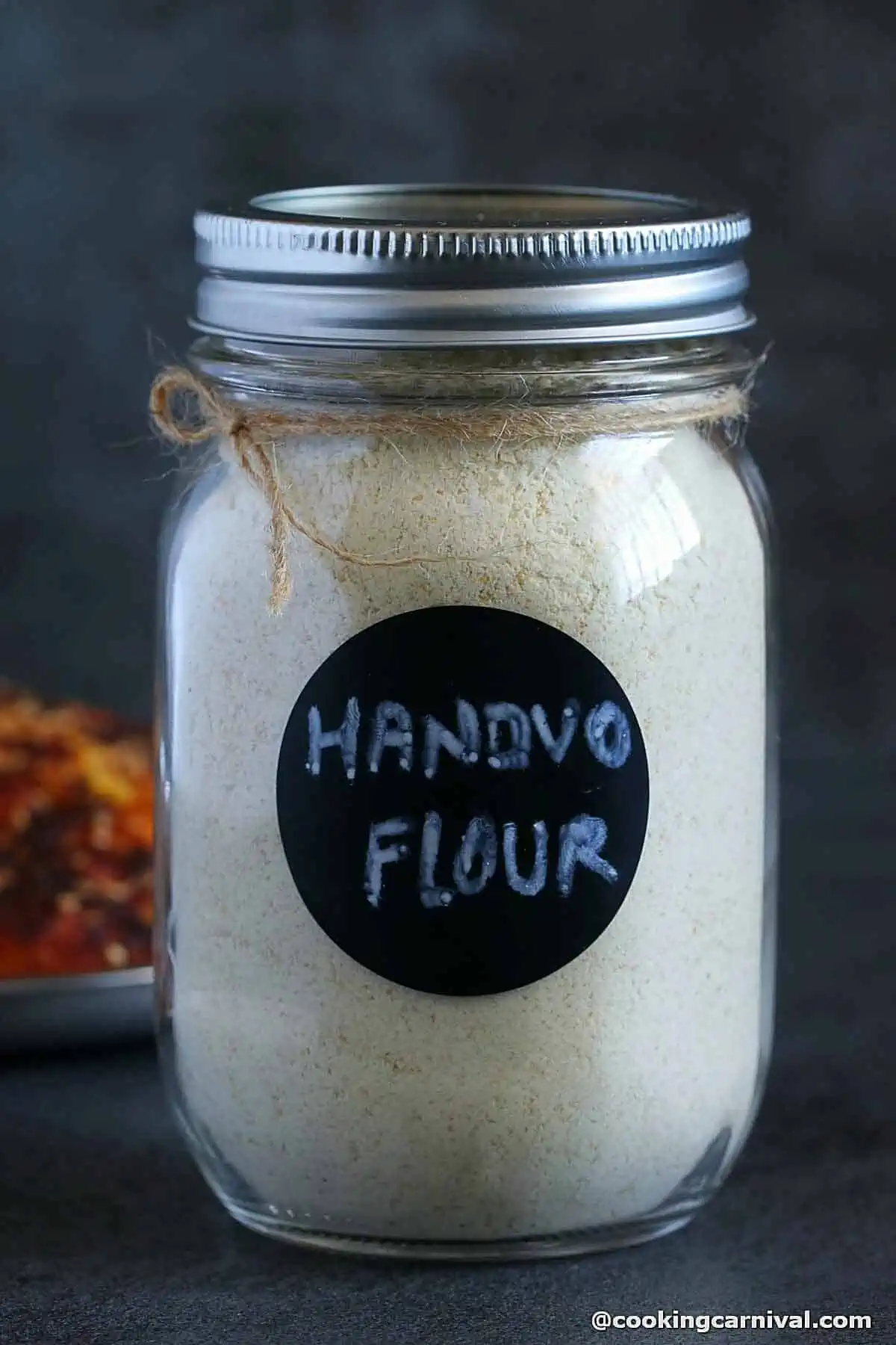 Handvo flour in meson jar.