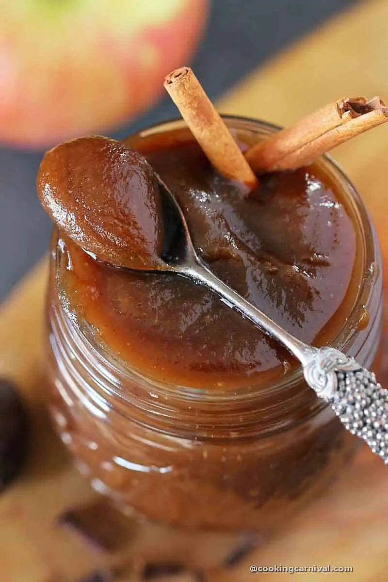 showing the texture of Instant pot apple butter with spoon