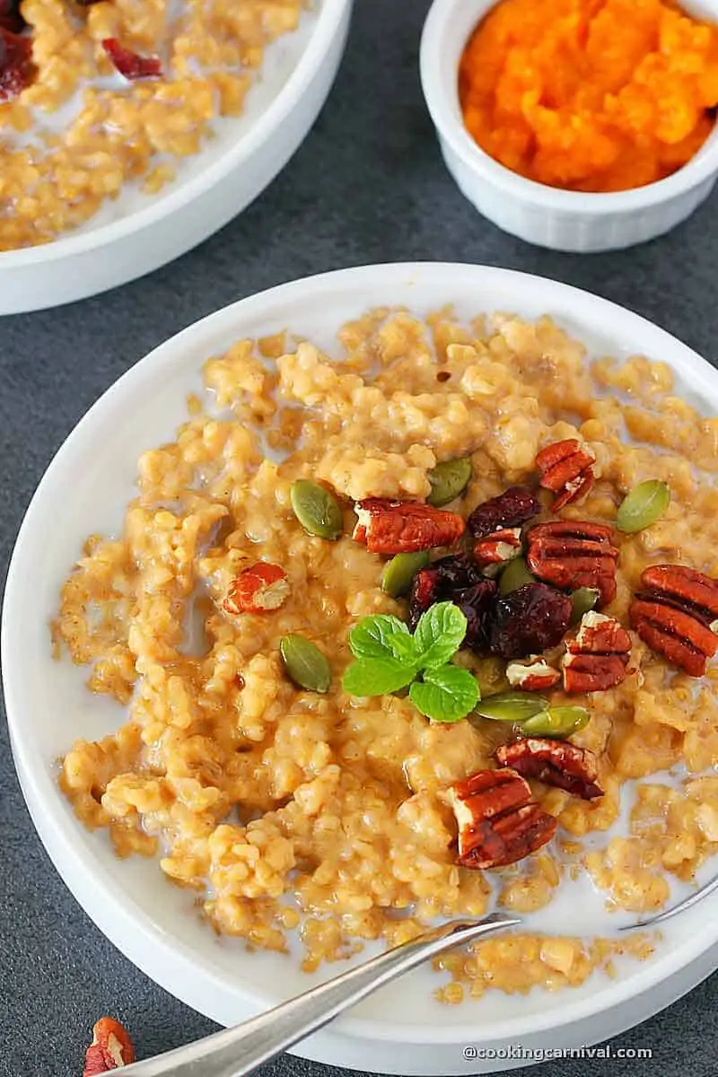 pumpkin oatmeal made in instant pot and served in white bowl.