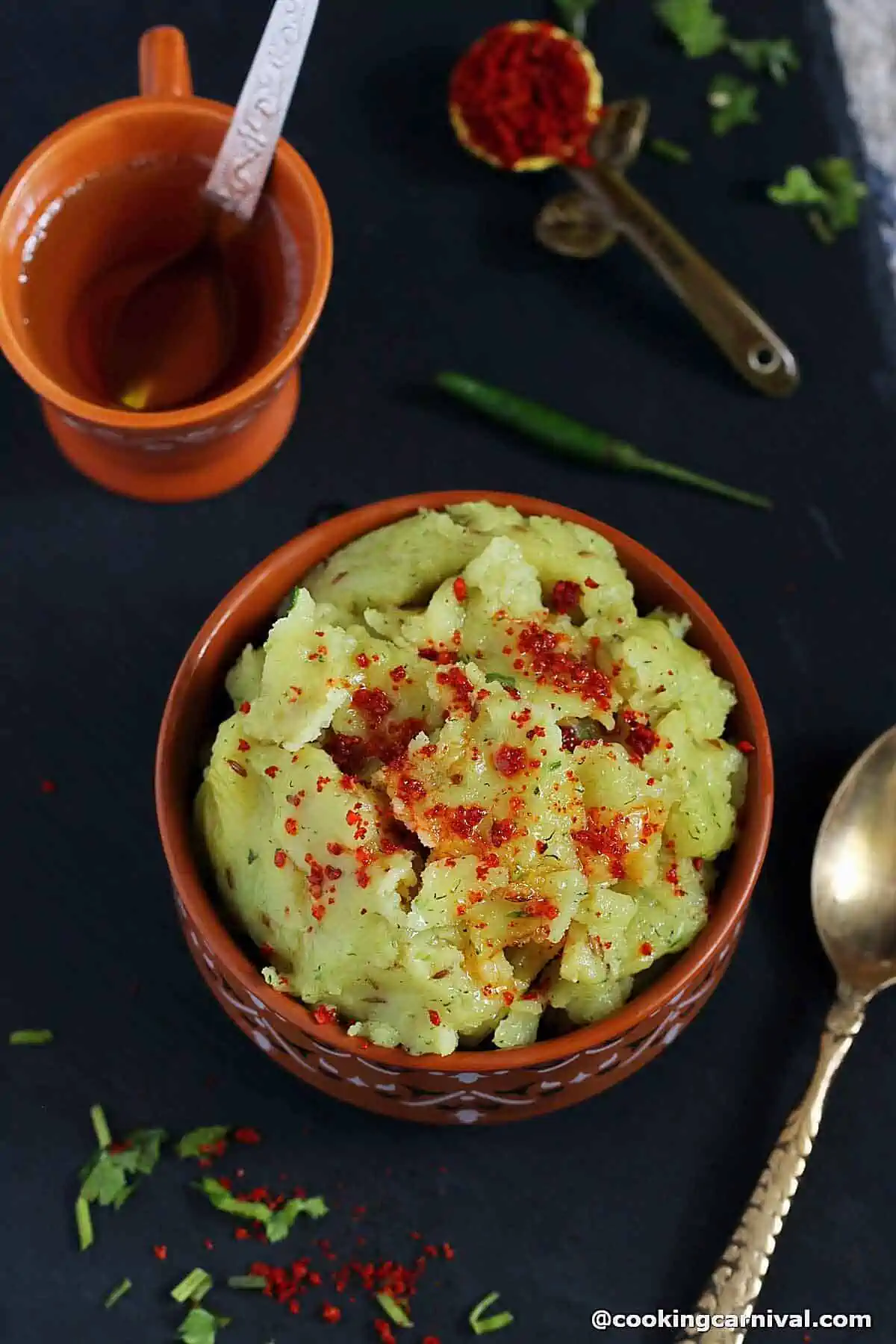 khichi - khichu papad no lot served in a bowl with groundnut oil and masala.