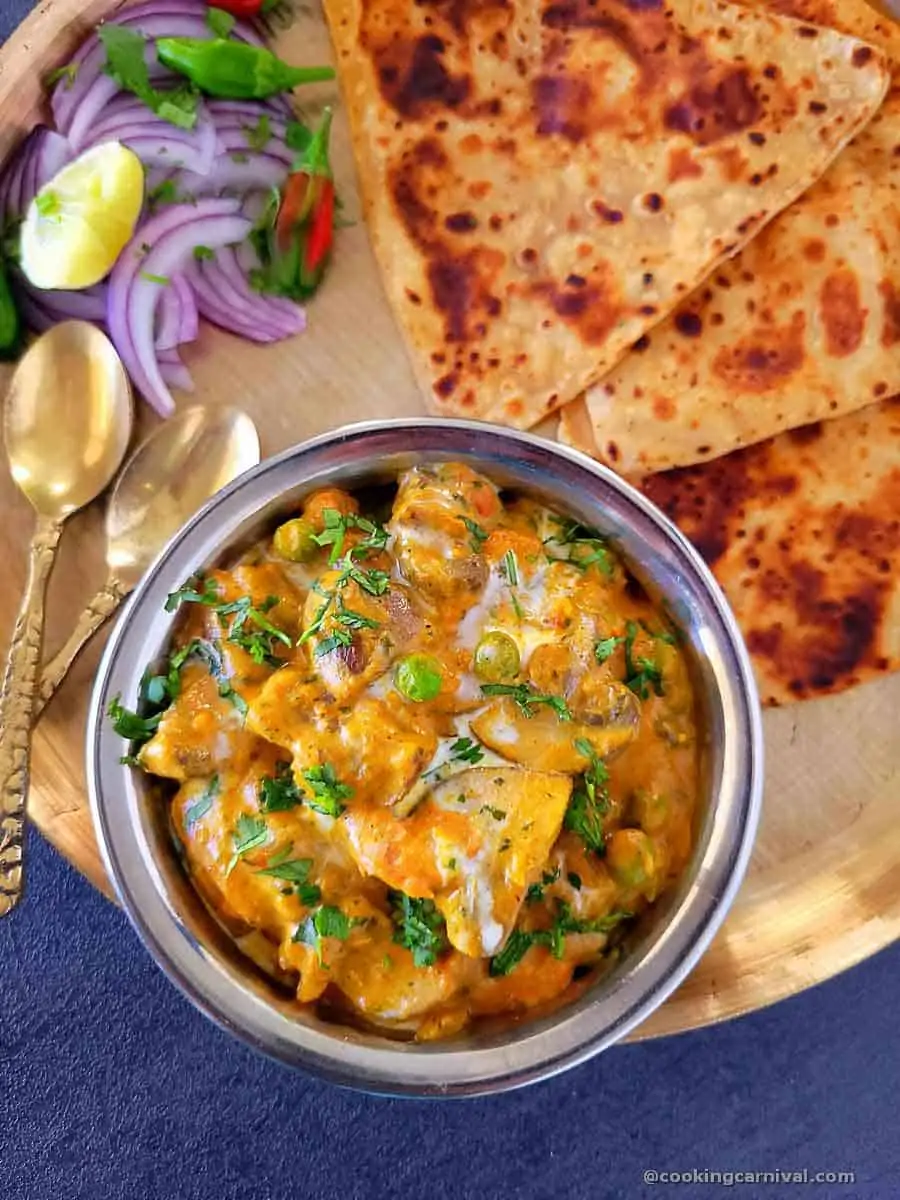 top view of Matar mushroom and paratha, onion on the sides