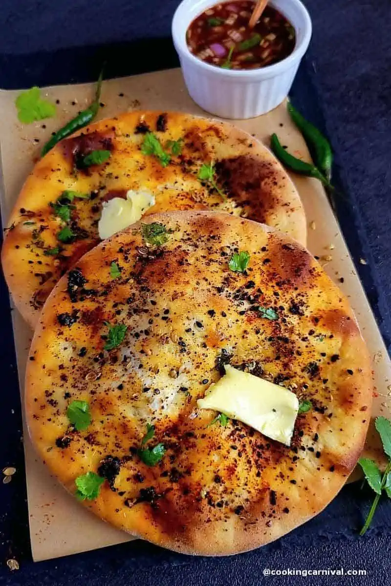 Close up shot of paneer kulcha, butter on top