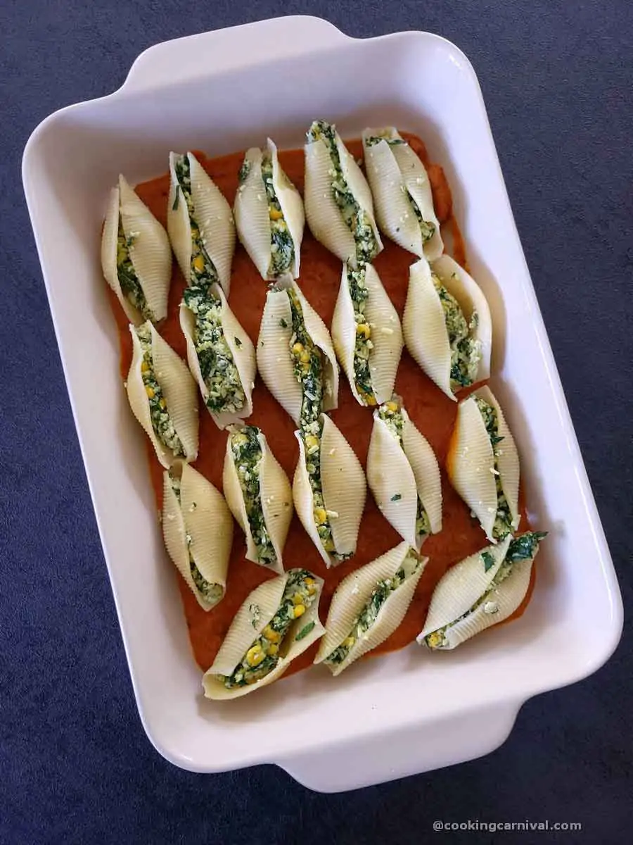 Stuffed jumbo pasta shell in a baking tray