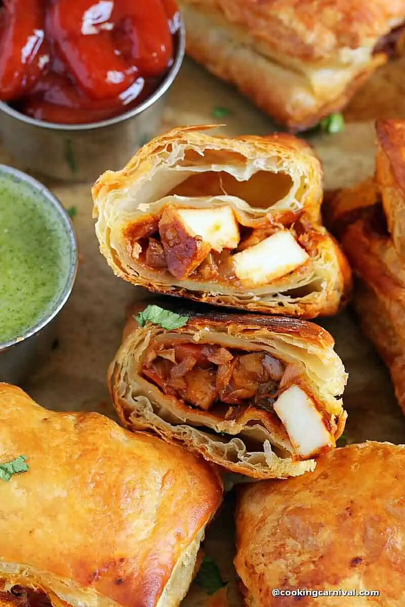 Showing inner stuffing of schezwan paneer puff