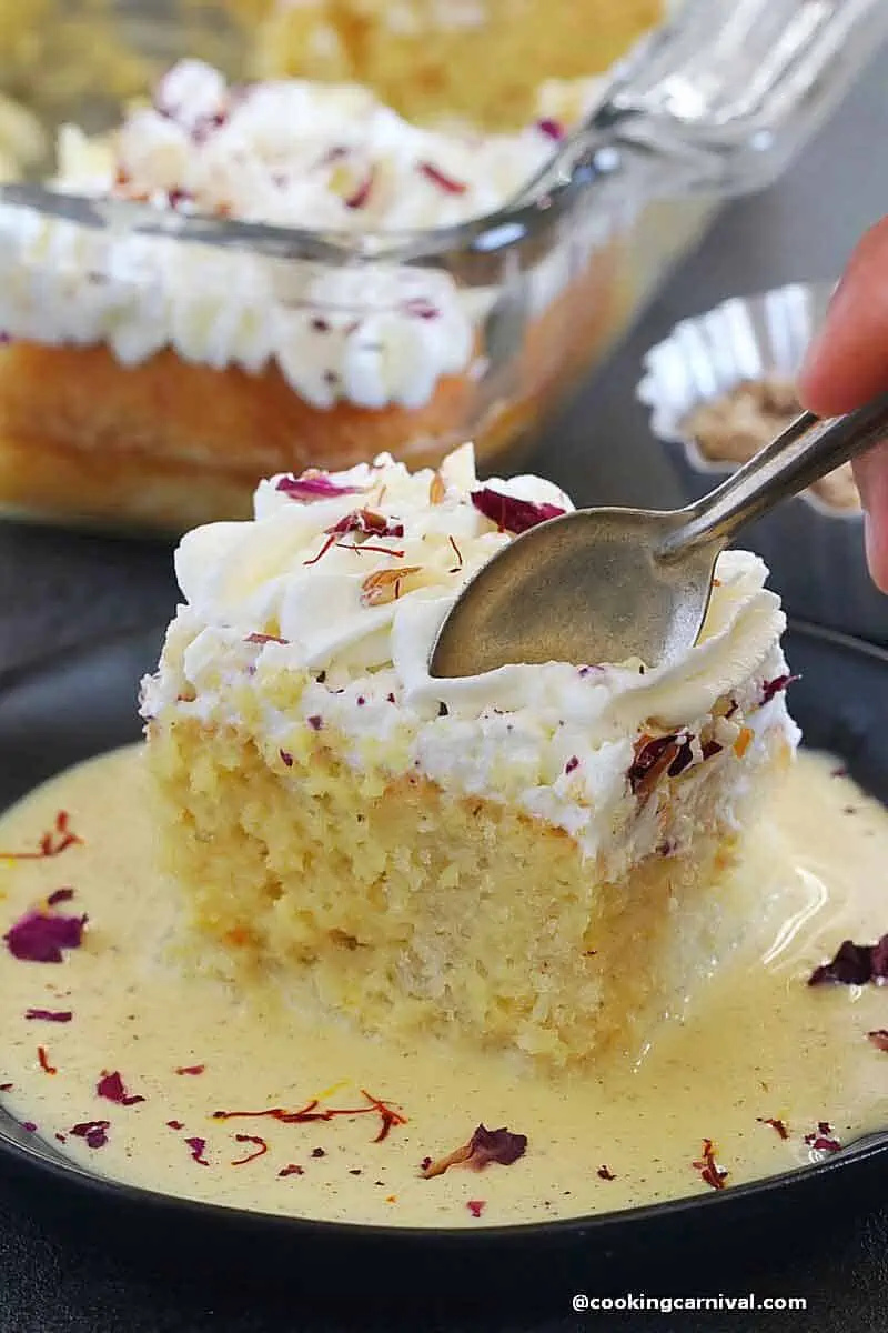 taking Thandai Tres leches cake bite with spoon