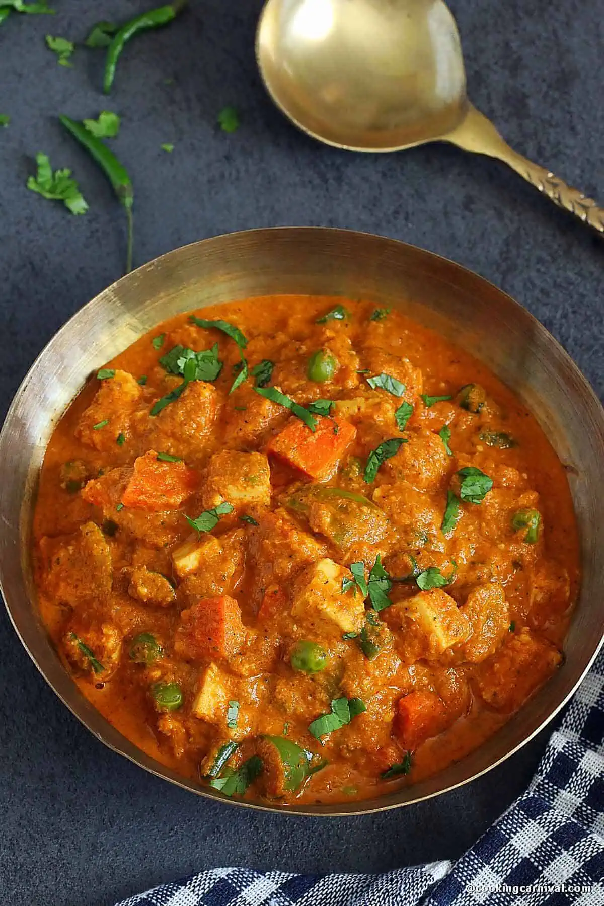 Mix veg maratha in kansa bowl, spoon on the side.